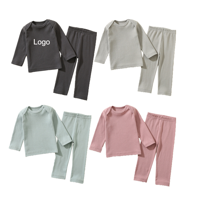 Quần áo trẻ em bông rắn cotton o cổ cô gái quần áo